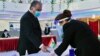 TAJIKISTAN -- Tajik President Emomali Rakhmon receives his ballot at a polling station during presidential election in Dushanbe, October 11, 2020