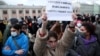 RUSSIA – A demonstrator holds up a sign reading "today they kill Navalny, tomorrow they kill me" during a rally in support of jailed Russian opposition politician Alexei Navalny in Moscow, April 21, 2021