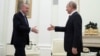 RUSSIA -- Russian President Vladimir Putin approaches to shake hands with Turkish President Tayyip Erdogan during a meeting in Moscow, March 5, 2020