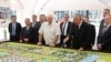  BELARUS -- Belrusian President Alyaksandr Lukashenka (center) visits the Belarusian Biotechnological Corporation with a man (holding the pointer) who looks like Kyrgyzstan's wanted former prime minister, Daniyar Usenov, August 10, 2020